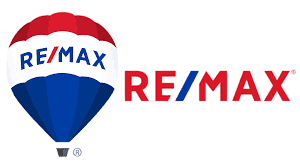 Logo von RE/MAX mit einem roten, weißen und blauen Heißluftballon und dem Schriftzug „RE/MAX“ in Rot.